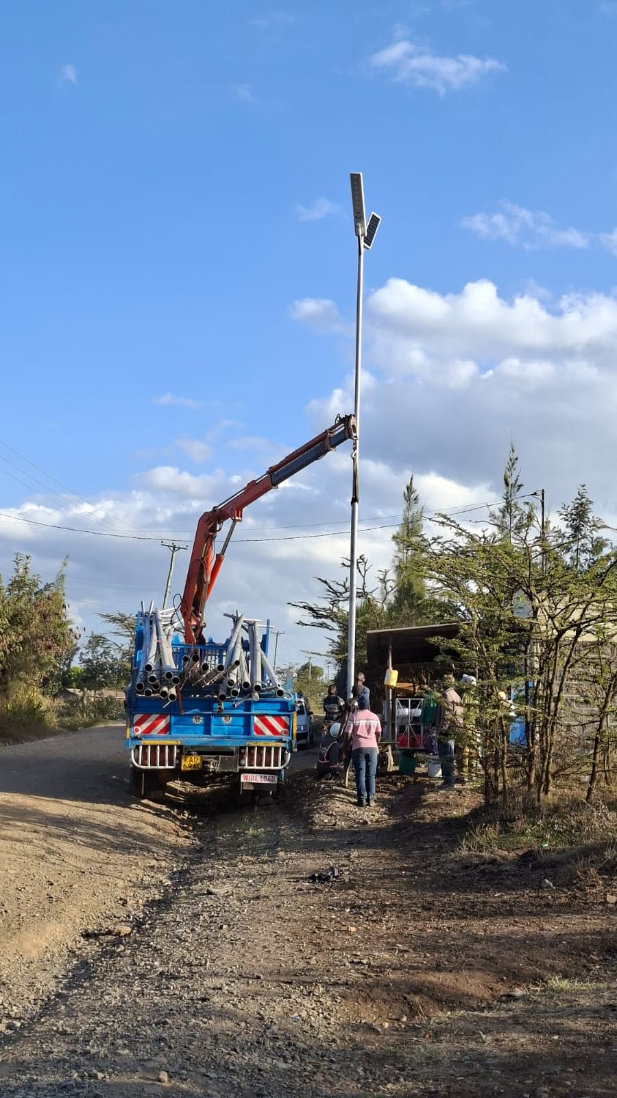 Solar street light installation along a Kenyan road